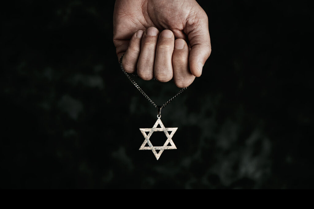 man with a pendant in the shape of the star of david
